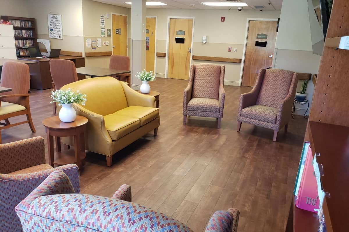 Bright common area with seating for residents