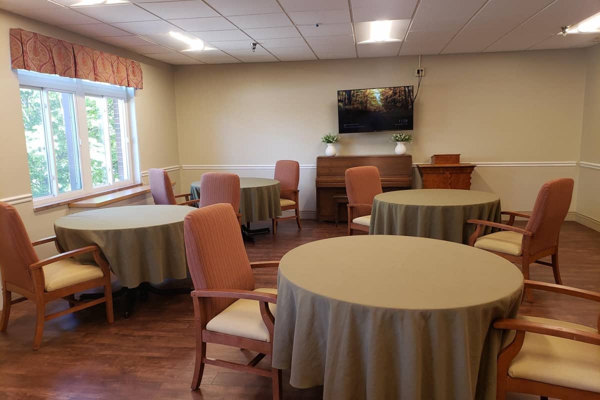 Bright common area with tables and chairs