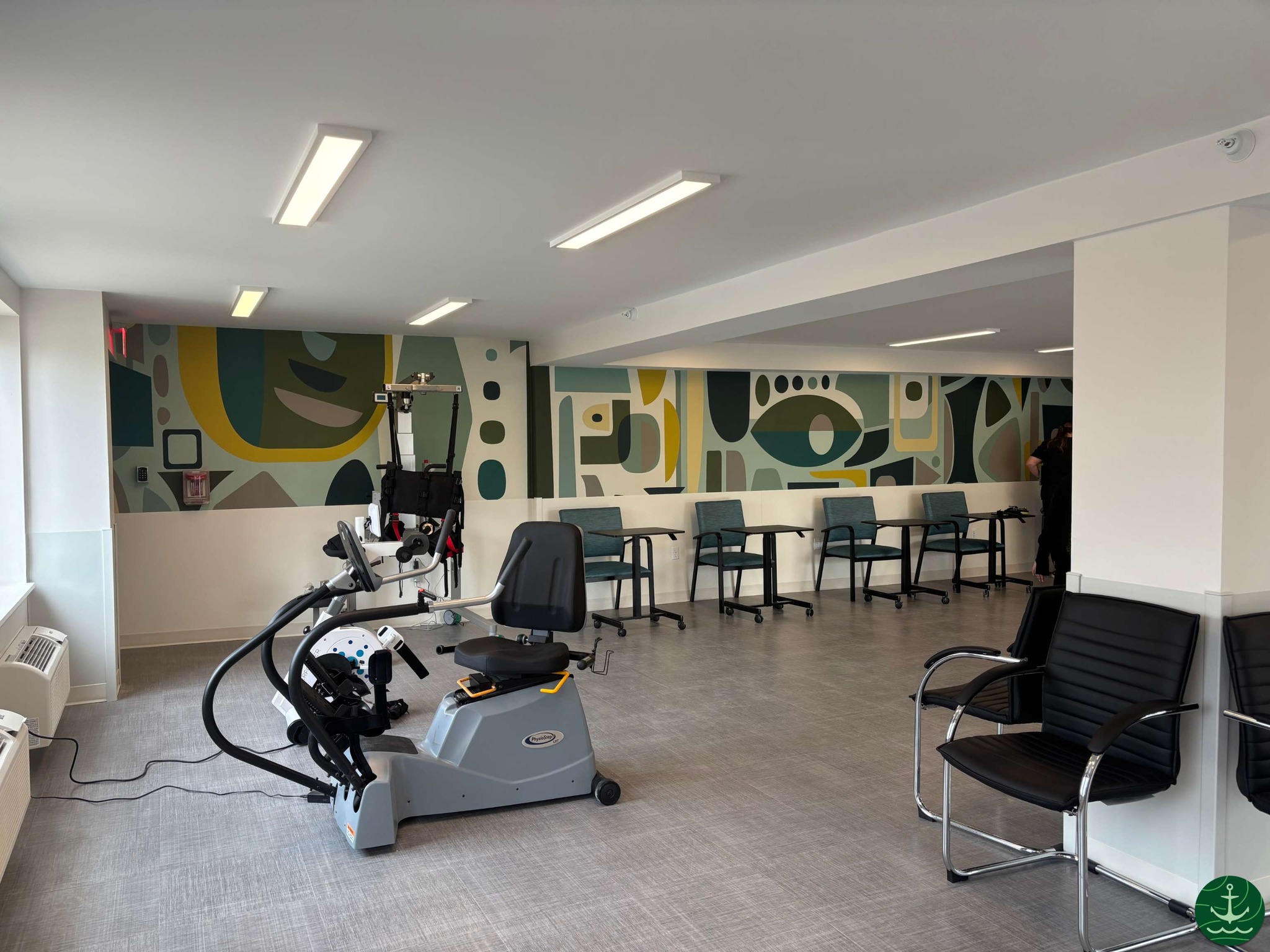 Activity room with therapy equipment and modern decor