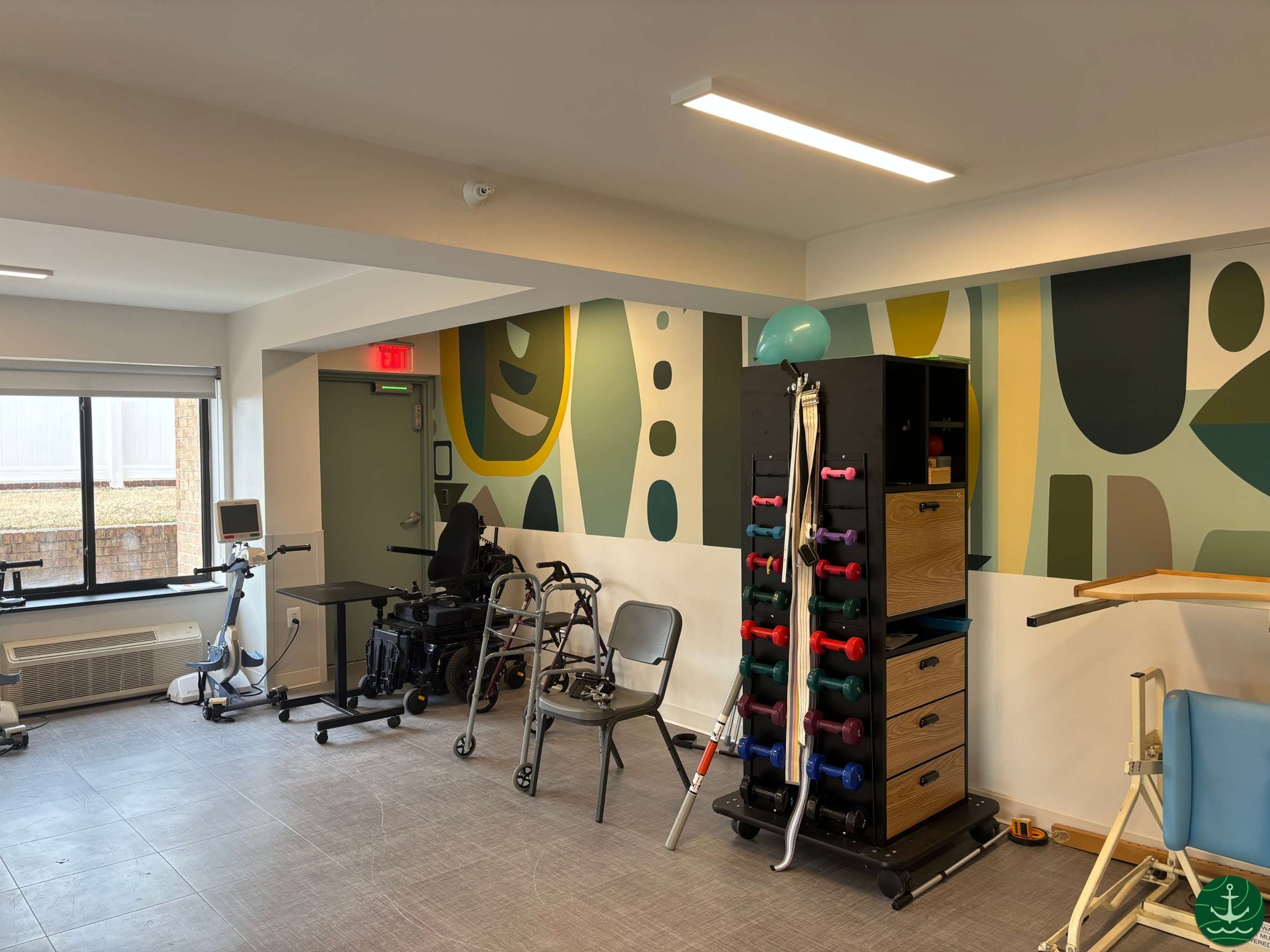 Interior view of a physical therapy room with equipment