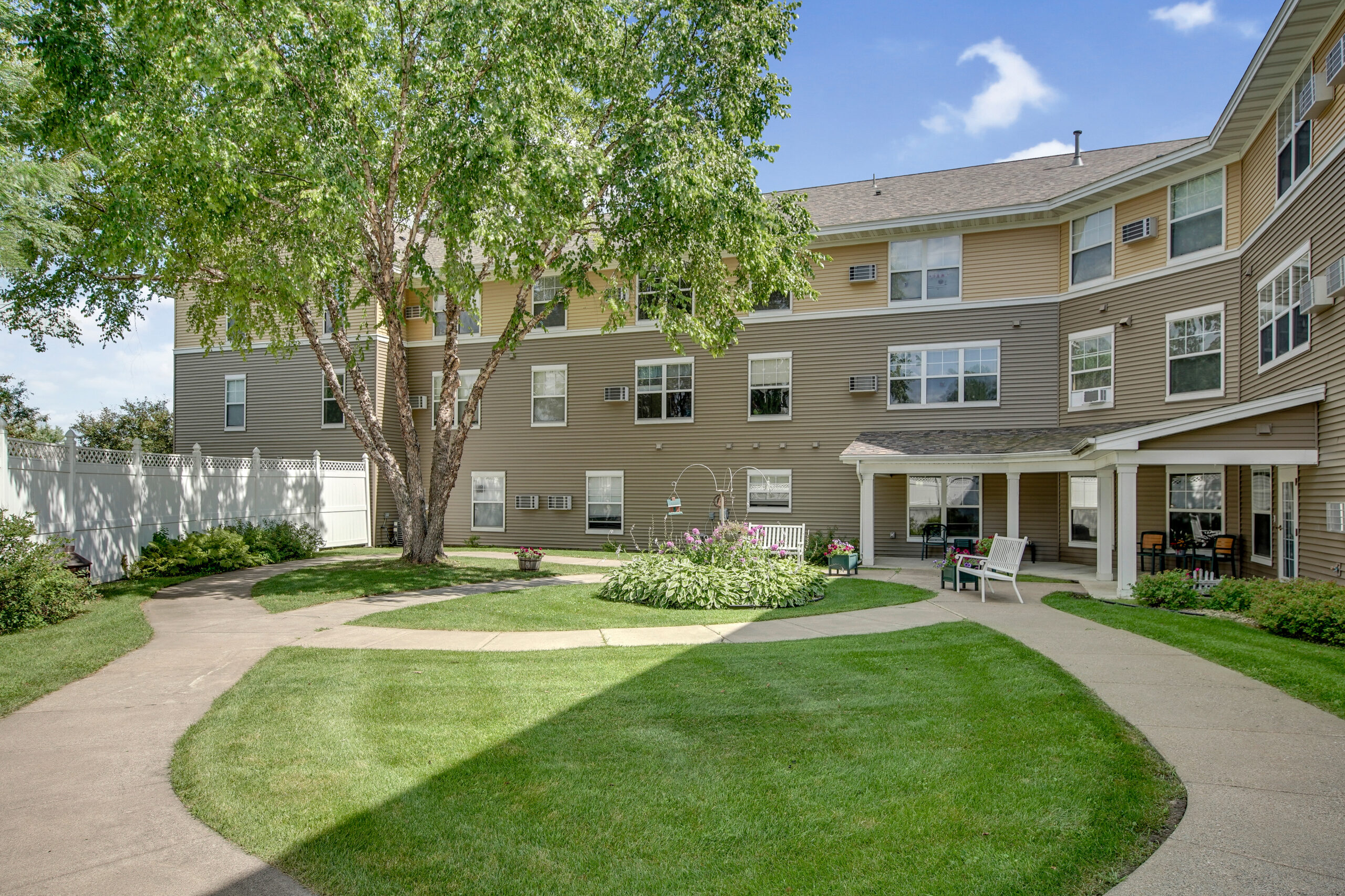 Exterior view of an assisted living facility with landscaping