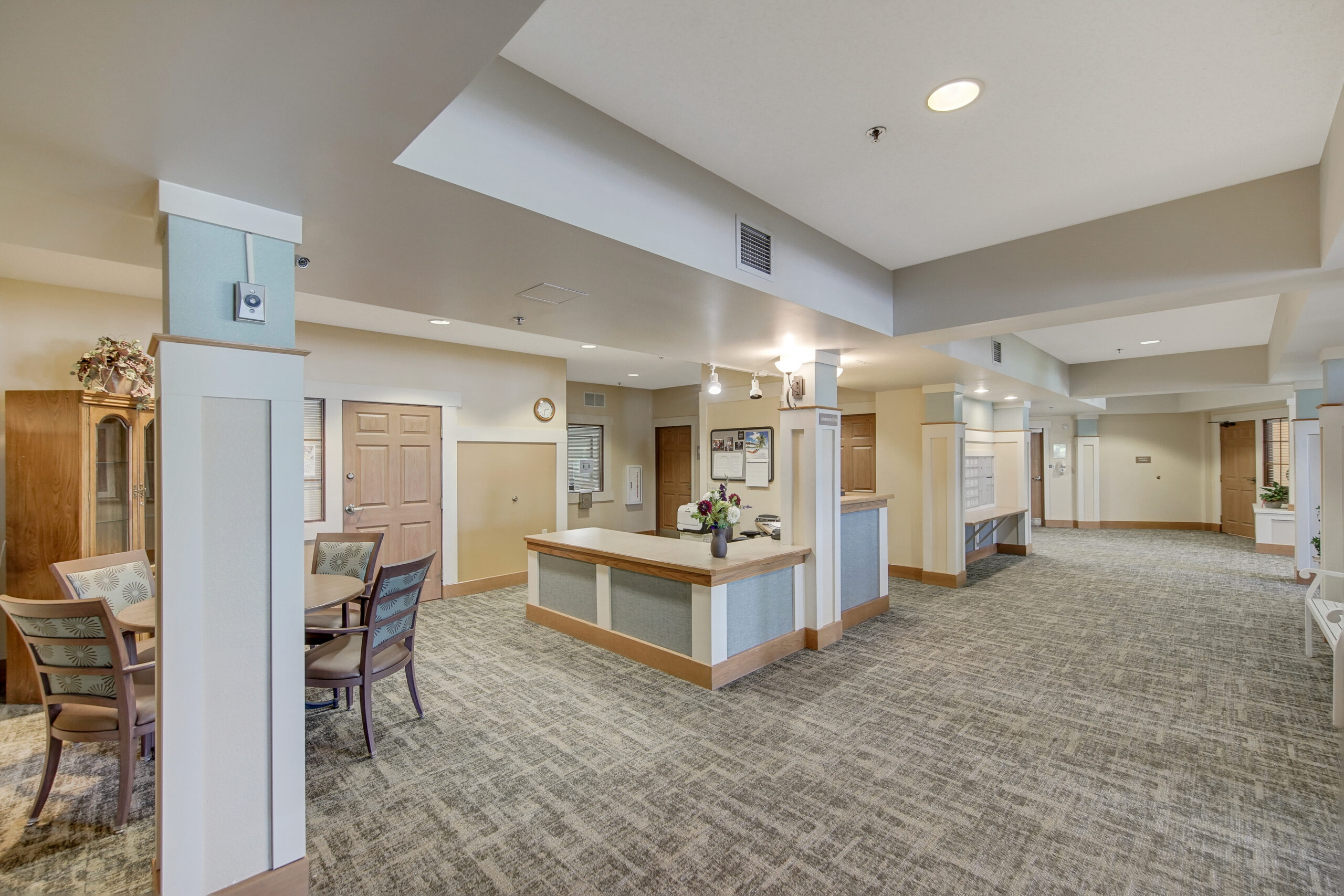 Bright common area with seating and reception desk