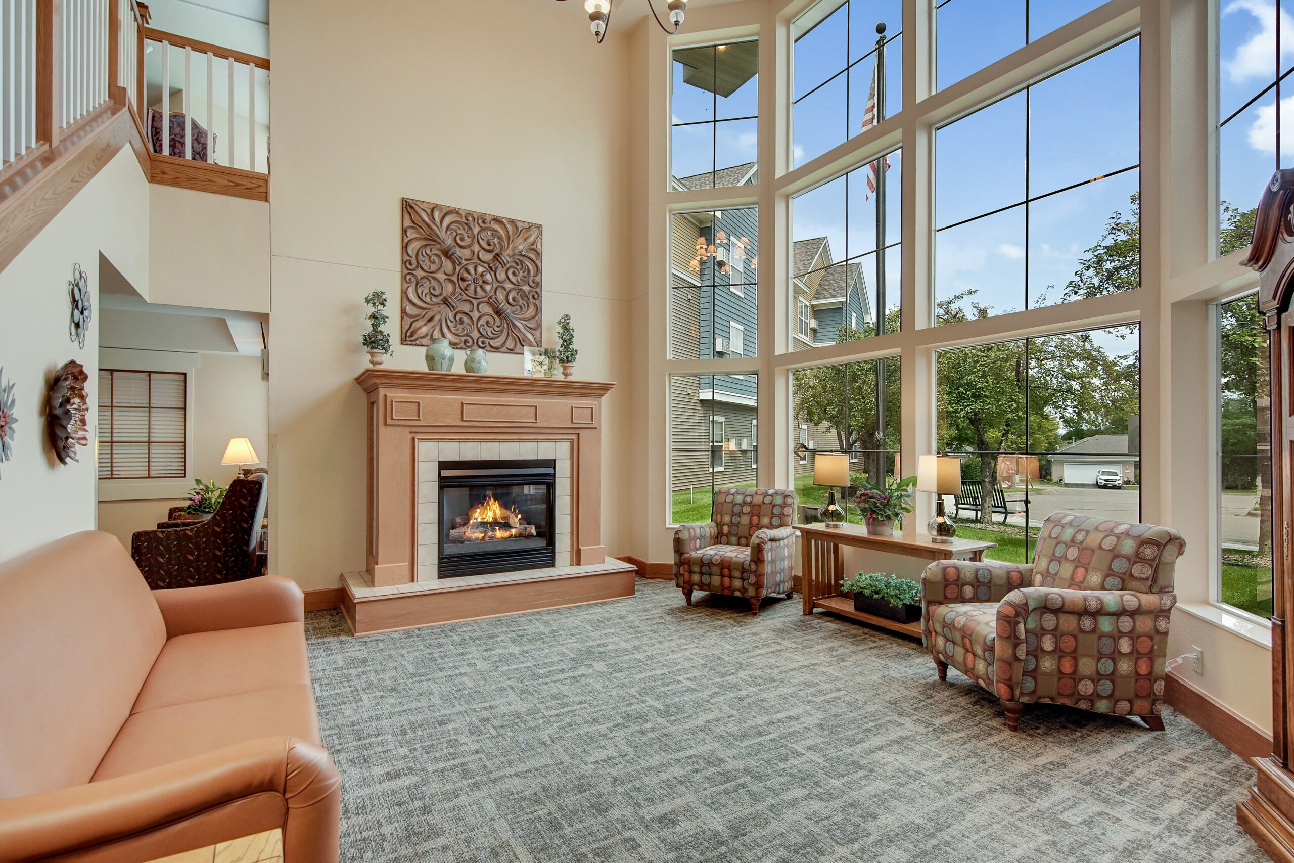 Bright common area with a fireplace and seating