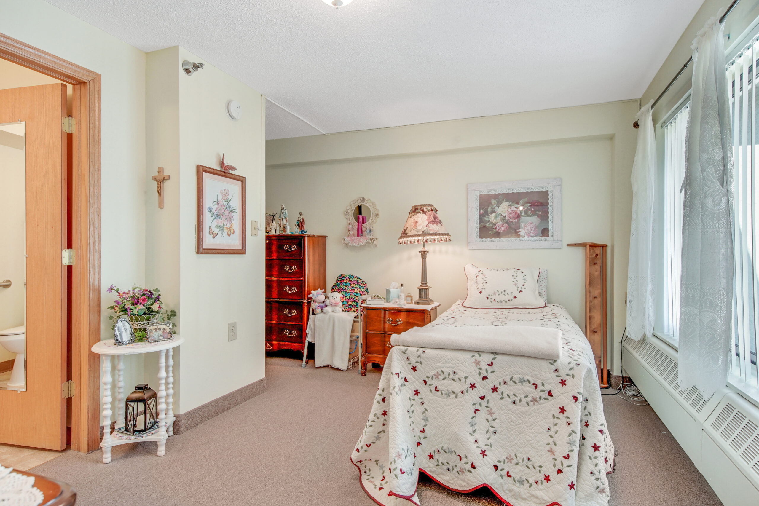 Cozy resident room with personal decor and furniture