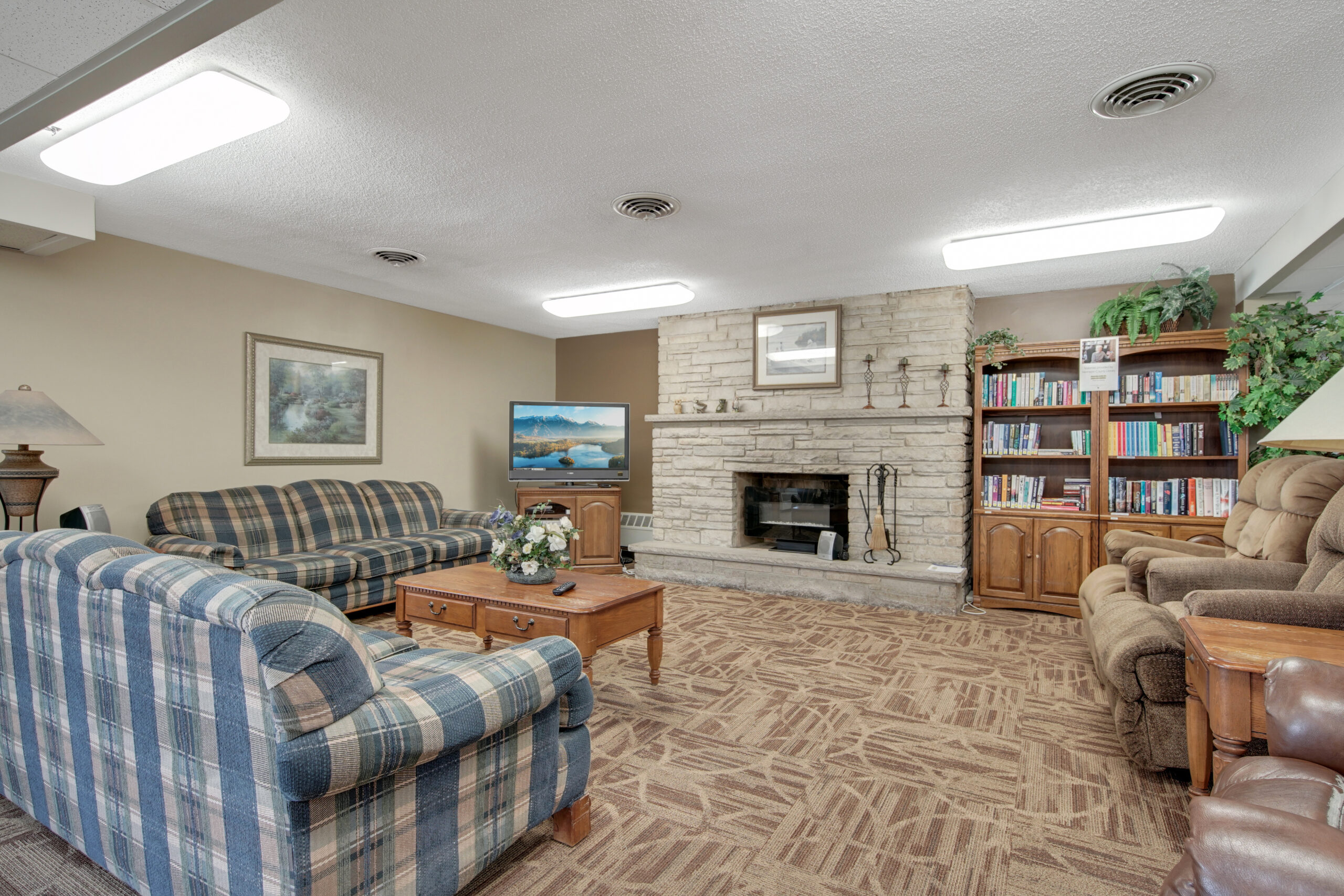 Cozy common area with seating and fireplace