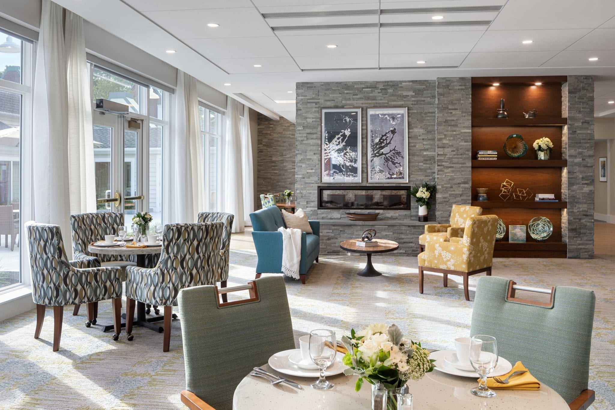 Bright dining room with decorative furnishings and flowers