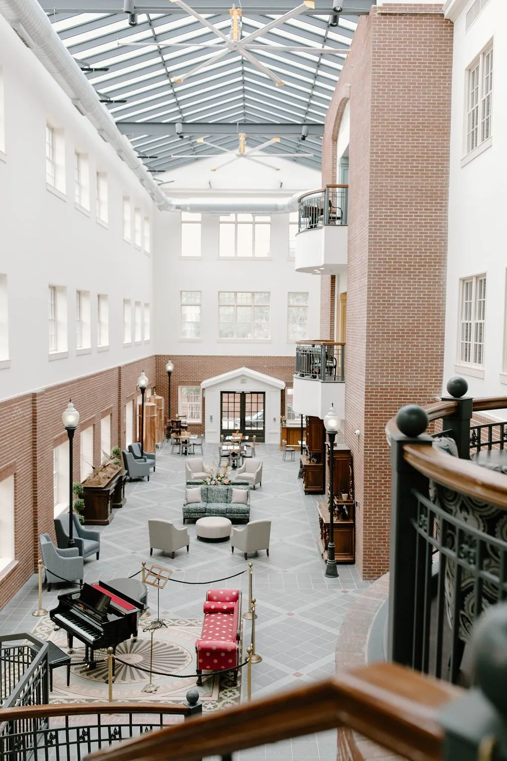 Bright common area with seating and piano