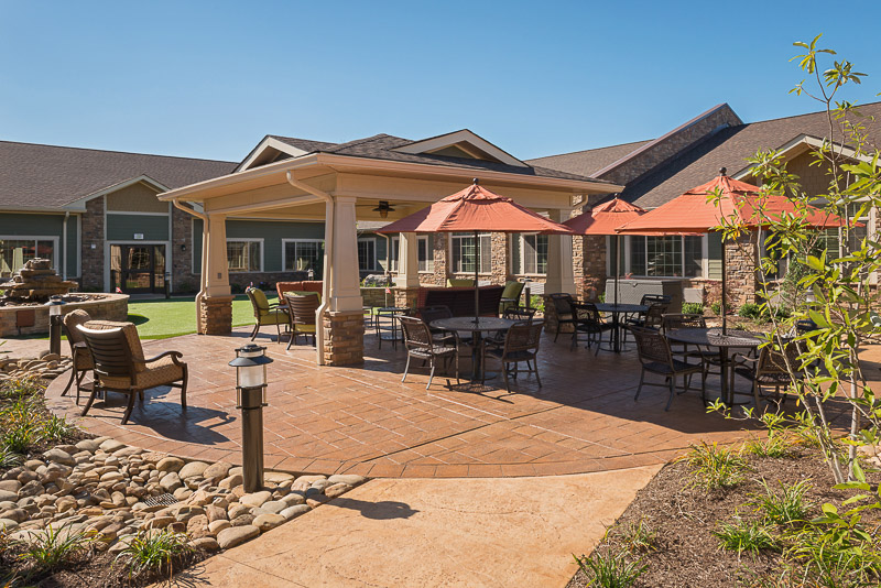 Outdoor patio area with seating and umbrellas