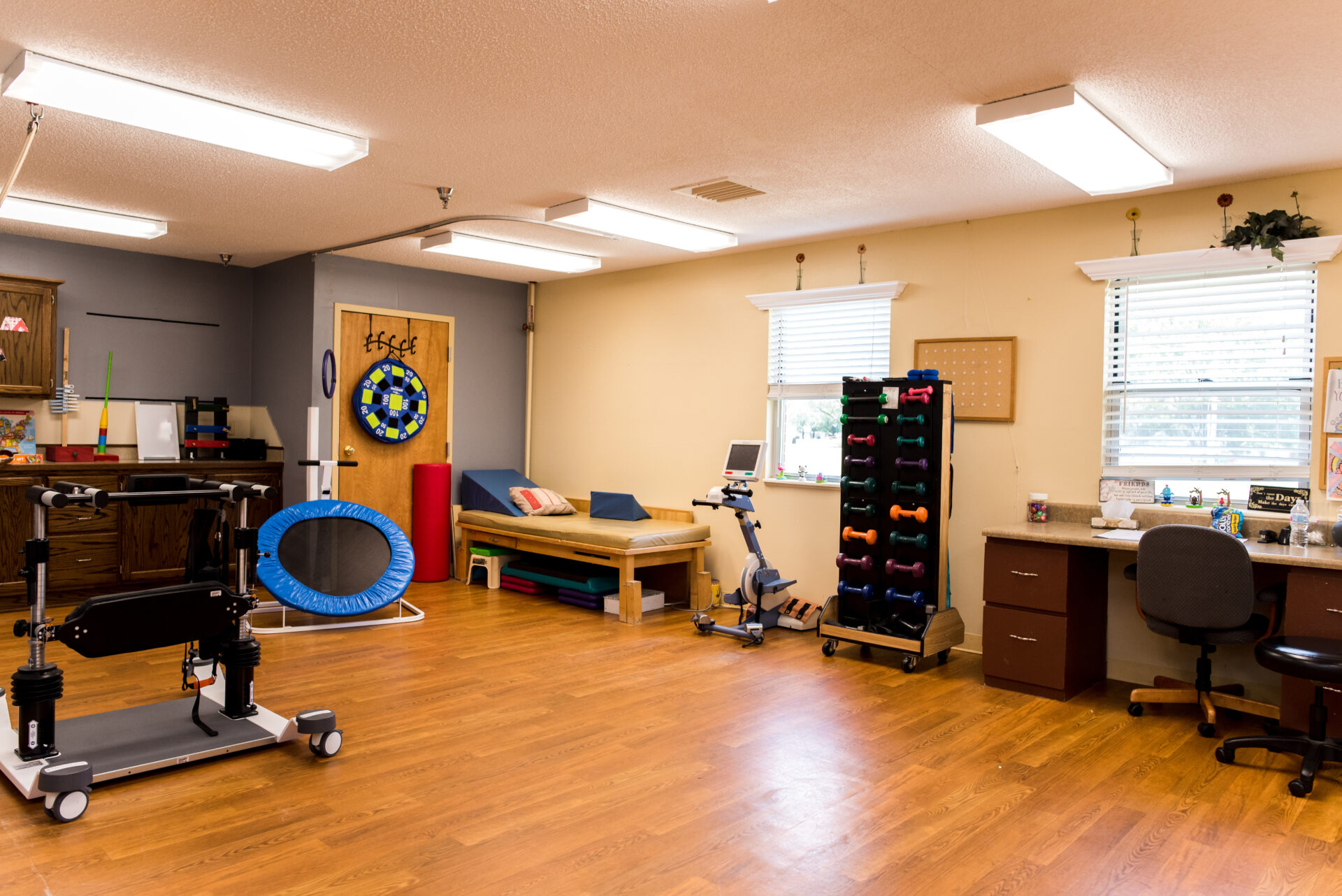 Interior view of a therapy room with exercise equipment