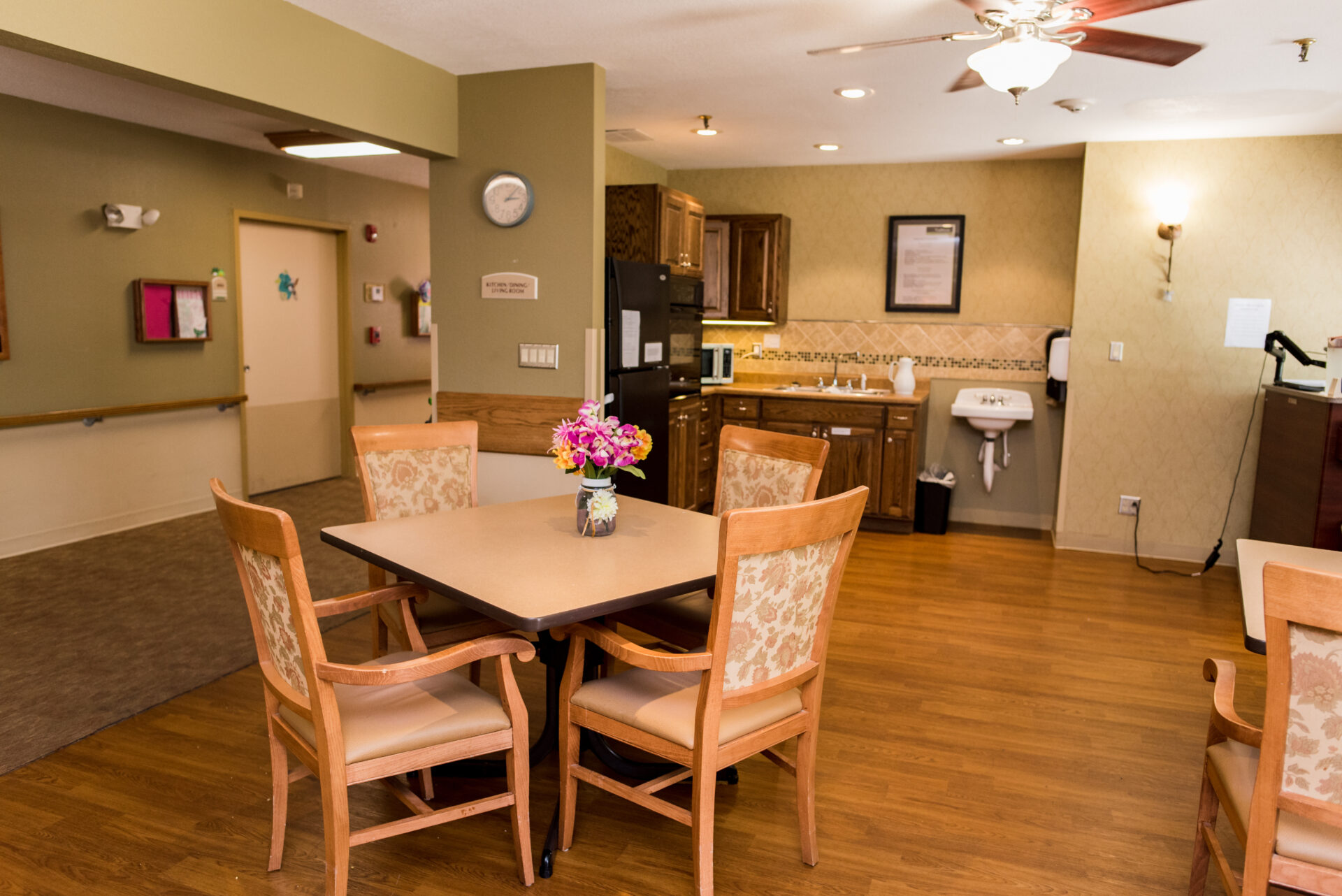 Interior view of a common area with seating and kitchen