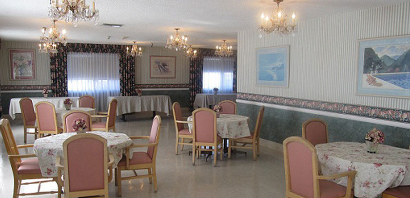 Dining area with tables and floral decorations