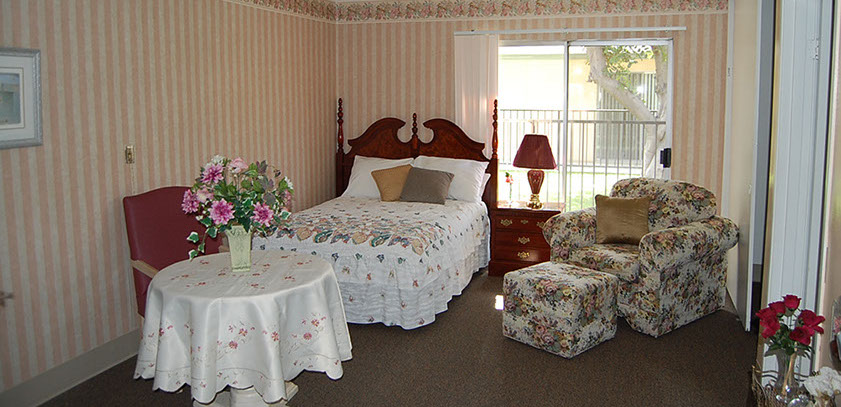 Cozy resident room with floral decor and natural light