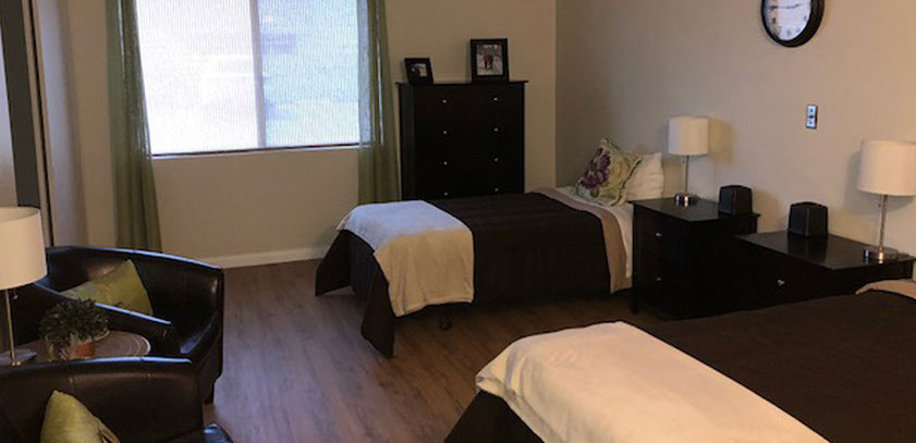 Shared resident room with two beds and furniture