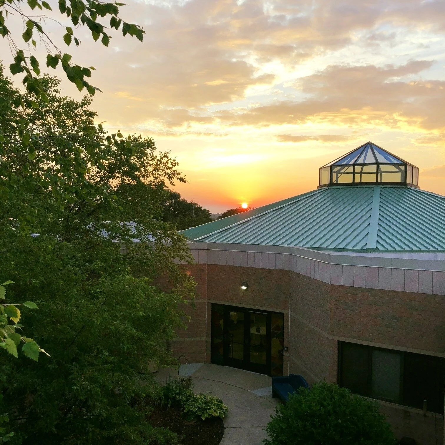 Sunset over the facility's architectural roof
