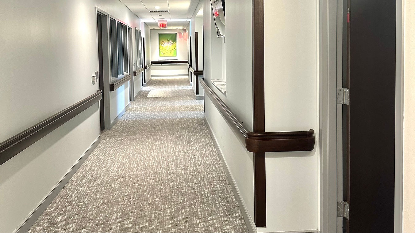 A well-lit corridor inside the senior center
