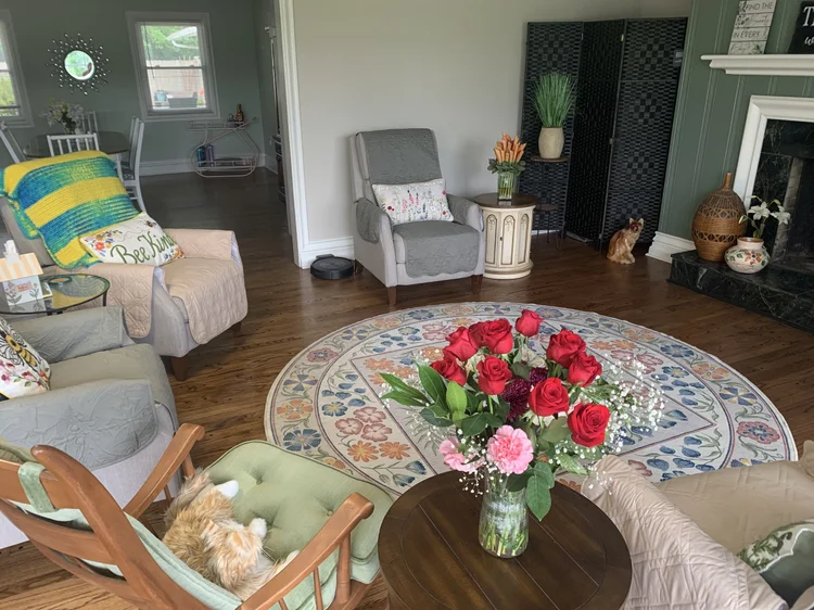 Cozy interior common area with seating and flowers