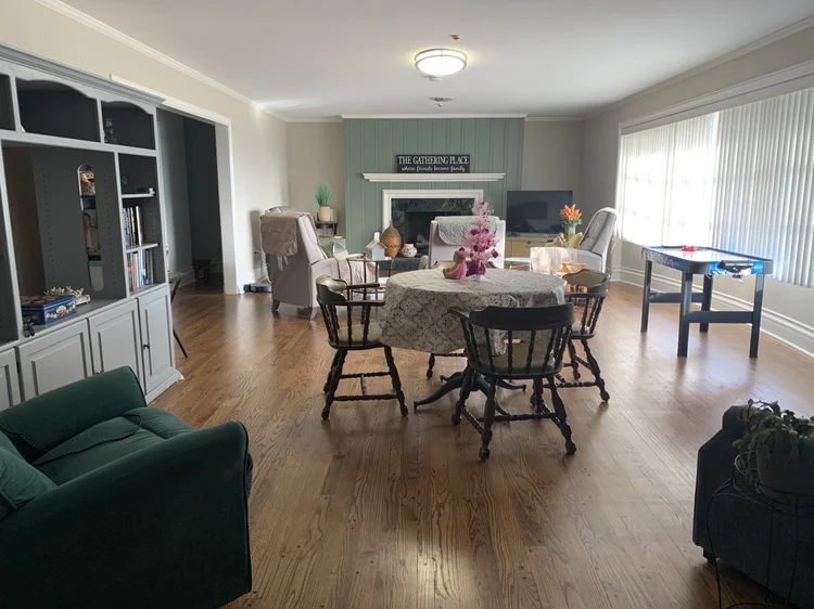 Bright common area with seating and a table
