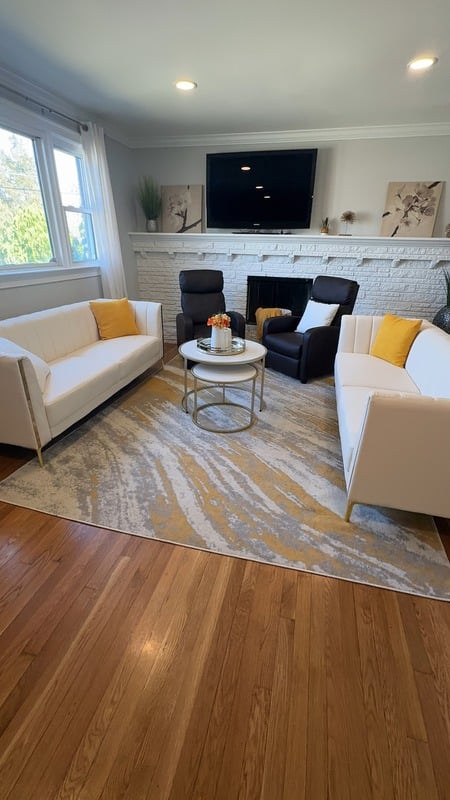 A cozy common area with comfortable seating and a coffee table