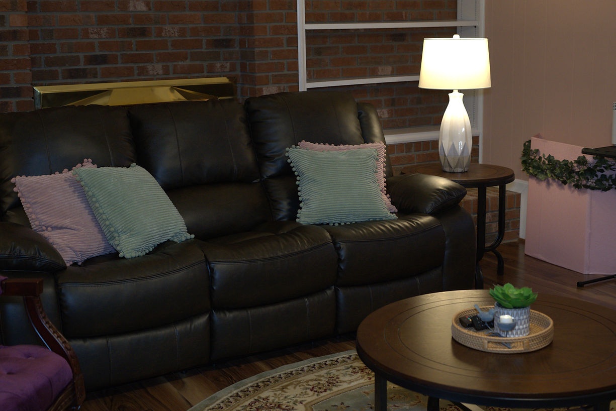 Cozy living room area with a couch and lamp