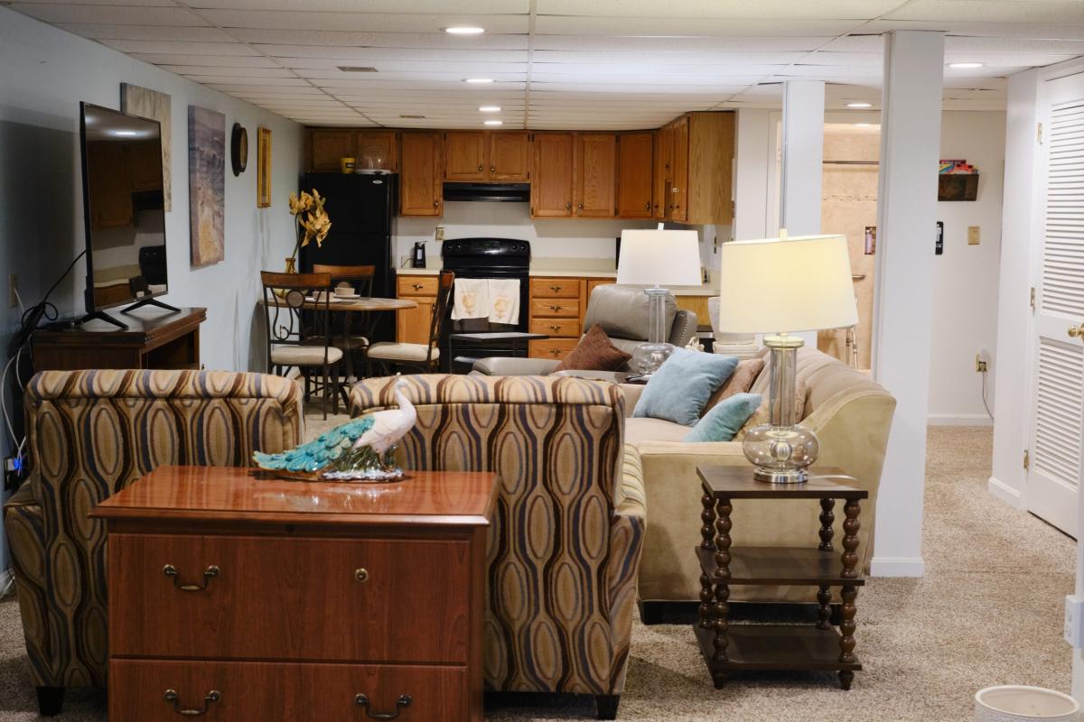 Interior view of a common area with seating and kitchen