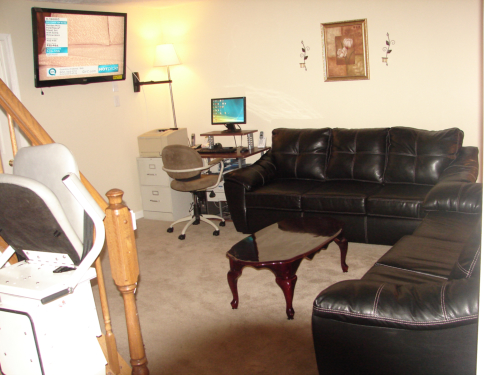 Cozy living room area with a couch and TV