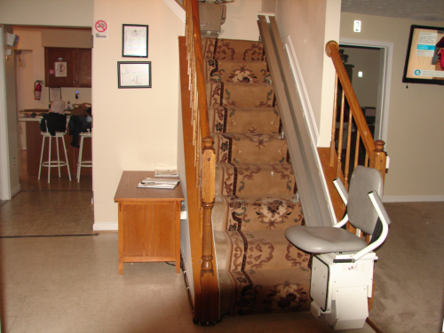 Stairs with a stairlift in a home setting