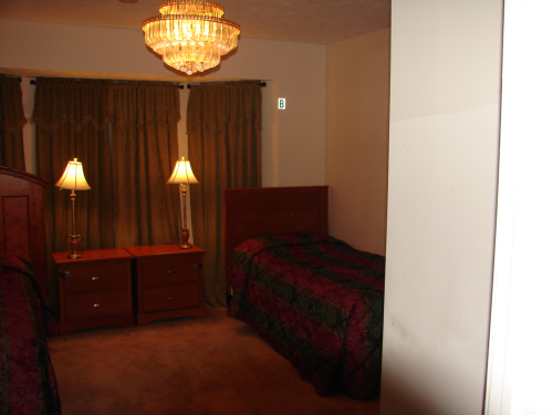 Cozy resident room with beds and lamps