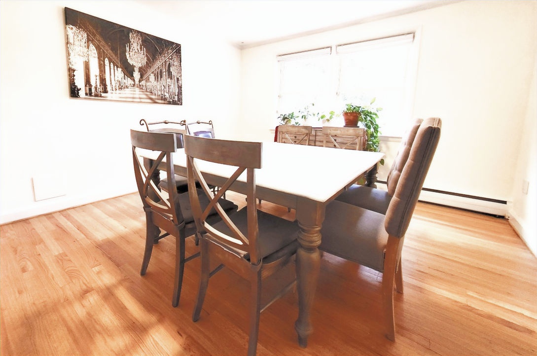 Cozy dining area with wooden table and chairs