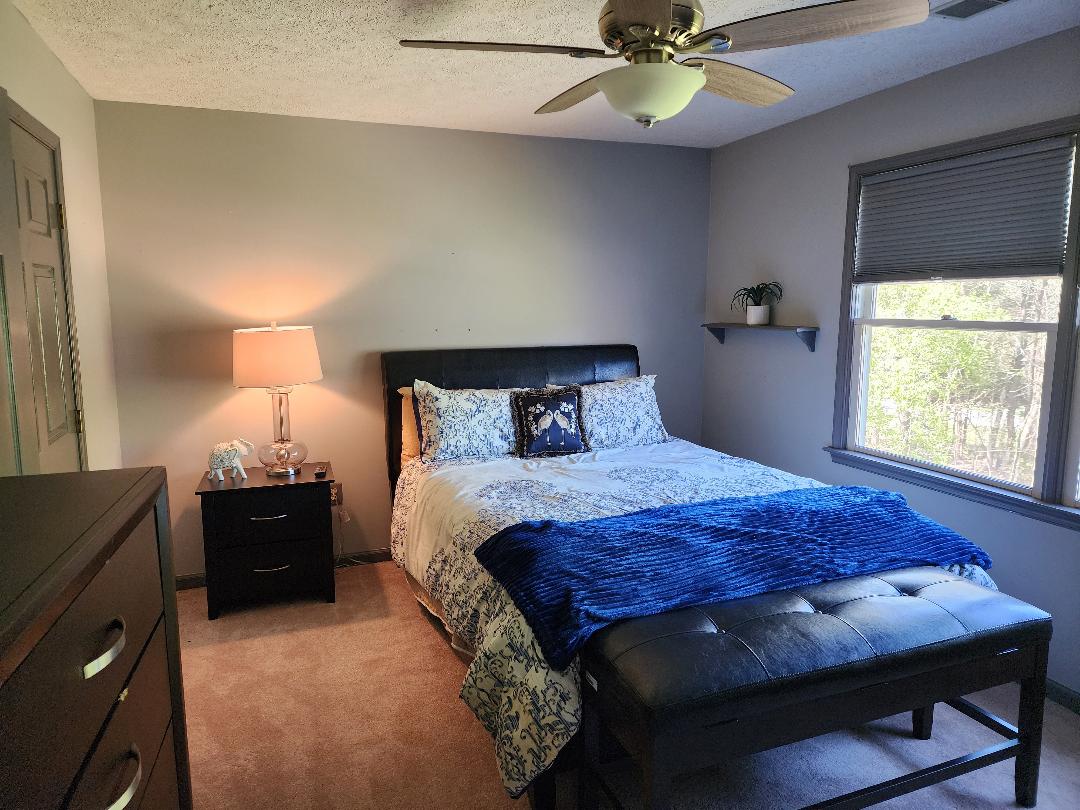 Cozy resident room with a bed and lamp