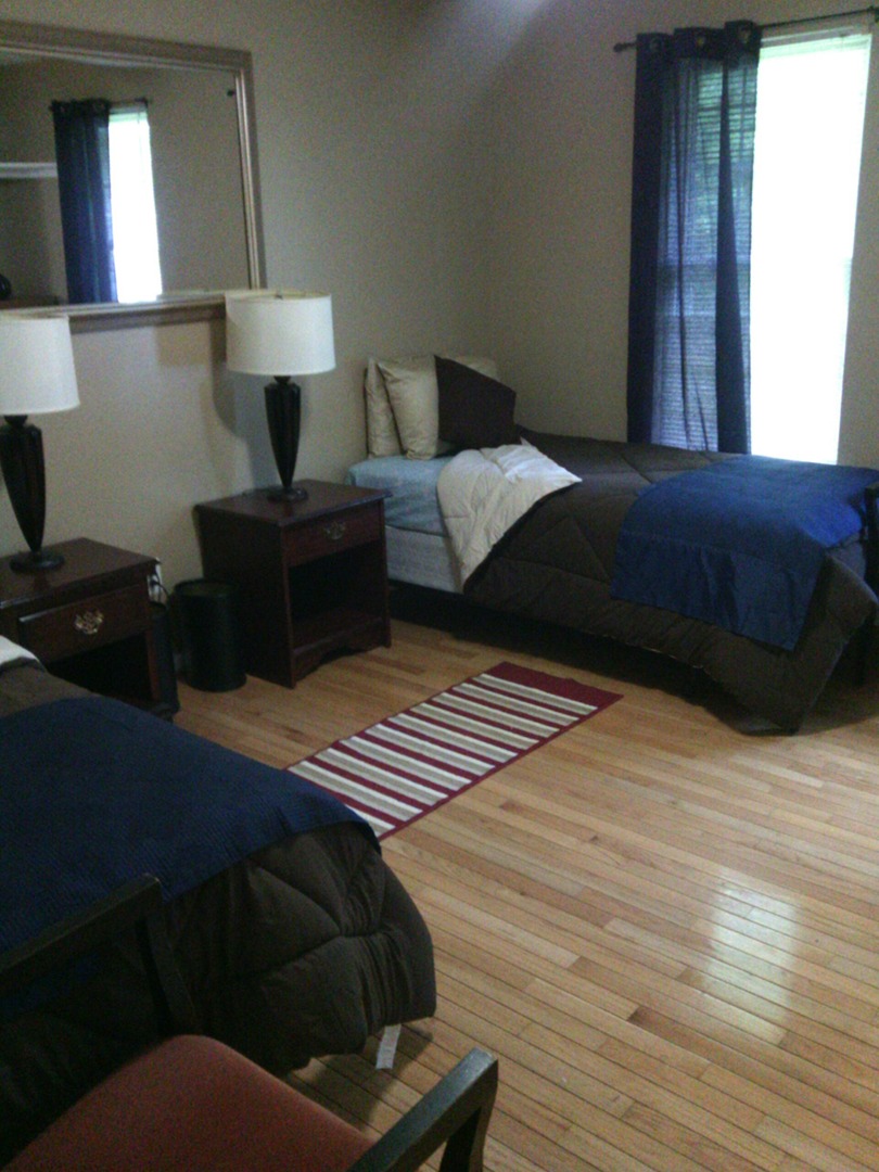Cozy resident room with beds and decor items