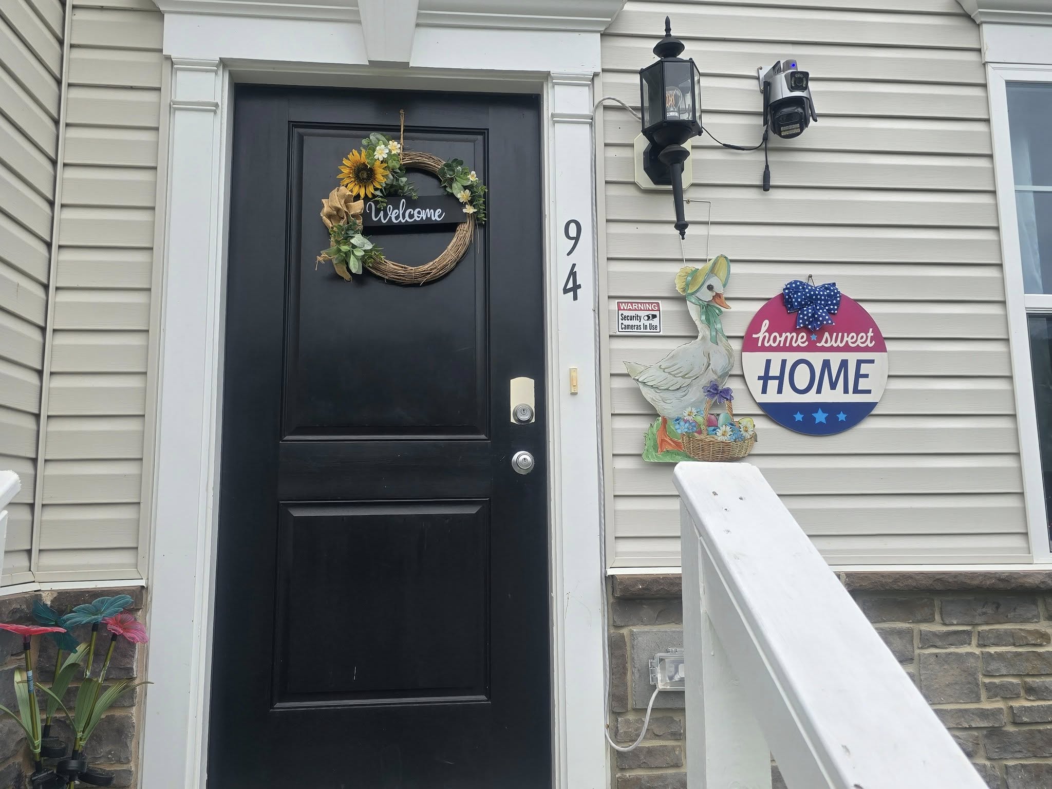 Front entrance with welcome sign and decor